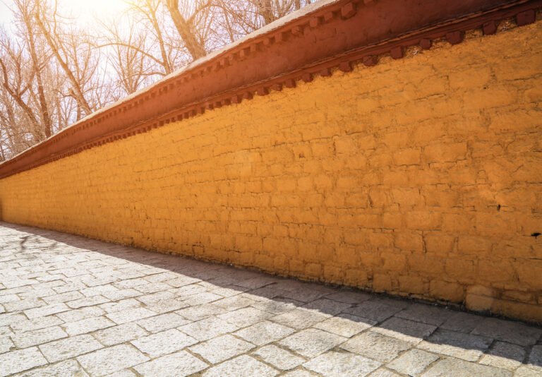 Yellow walls, stone road